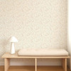 Scion Dove & Deer Pebble wallpaper styled behind a wooden bench, showcasing detailed woodland motif.