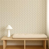 Scion Hares Pebble wallpaper styled behind a wooden bench, showcasing subtle beige hare pattern.