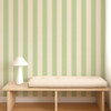 Scion Central Stripe Pea Green wallpaper used behind a wooden bench, highlighting fresh green vertical stripes.