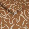 Made Varri Burnt Orange wallpaper roll close-up showing cream looping line pattern on terracotta background.