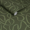 Made Varri Moss wallpaper roll close-up showing abstract looping green line pattern.