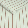 Made Kyria Mint Chocolate Stripe wallpaper roll close-up showing slim brown stripe pattern.