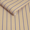 Made Kyria Neutral Blue Stripe wallpaper roll close-up showing narrow blue stripe pattern.
