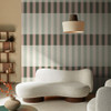 Made Terri Green and Blush wallpaper in modern living room with statement stripes and neutral furniture.