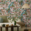 Holden Decor Italian Buildings Multi wallpaper used as a feature wall showing illustrated Italian village scene with houses and waterways