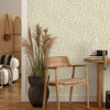 Holden Decor Coral Sage wallpaper used on living room walls featuring subtle green trailing botanical pattern