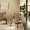 Romo Nyla wallpaper tawny neutral textured wall in modern living space with wooden chairs and plant