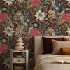 Holden Decor Grand Floral berry wallpaper feature wall behind bed with bold botanical floral design