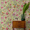 Holden Decor Floral Fruit wallpaper sage feature wall behind wooden cabinet with tropical botanical fruit design