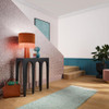 Galerie rose hexagon wallpaper feature wall with lamp and interior styling