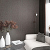 grey and copper floral wallpaper feature wall with sofa and modern interior styling