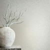 grey trellis wallpaper feature wall with textured vase and minimalist styling