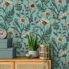 blue wildflower wallpaper feature wall with cabinet, plant and decorative accessories