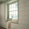 pink and green floral wallpaper feature wall with window seat and soft interior styling