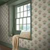 hyacinth floral wallpaper feature wall with window seat and painted green woodwork
