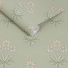 wallpaper roll showing hyacinth flower pattern with sage green background and pink detailing