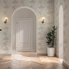 pearl wallpaper feature wall in hallway with archway and parquet flooring