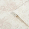 wallpaper roll showing jungle scene with layered plants in light neutral shades
