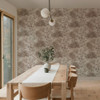 tropical wallpaper feature wall in dining room with wooden table and chairs
