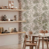 tropical wallpaper with shelving, dining table and light interior decor