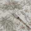 wallpaper roll showing jungle scene with layered tropical plants and soft neutral background