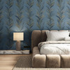 leaf flourish wallpaper feature wall in bedroom with upholstered bed and bedside table