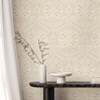 traditional damask wallpaper feature wall with small table and decorative vase