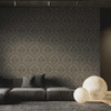 floral damask wallpaper feature wall in living room with sofa and soft lighting