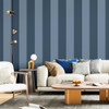 wide stripe wallpaper feature wall in living room with sofa, cushions and wooden coffee table