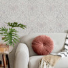 elegant wallpaper in living space with sofa and soft furnishings