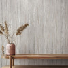 textured grey wallpaper with wooden bench and natural decorative elements