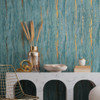 textured green wallpaper with gold accents in modern interior setting