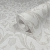 close up of damask wallpaper roll showing subtle shimmer texture
