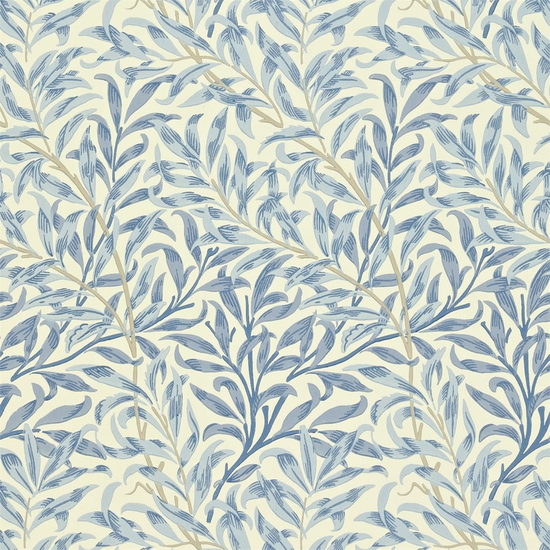 Morris & Co Willow Boughs Blue wallpaper showing flowing willow branches and delicate leaf pattern in soft blue tones inspired by William Morris botanical design