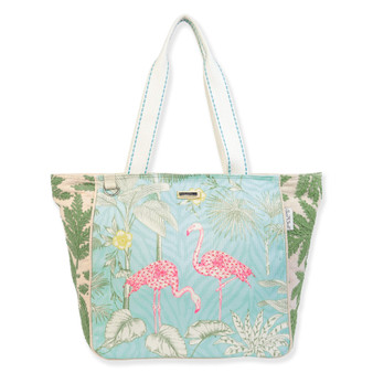 Canvas beach tote bag with illustrated pink flamingos, leafy tropical background, textured fabric panels, wide light blue handles, front view shown