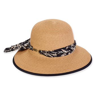 Three-quarter view of a tan woven straw sun hat featuring a rounded crown and a floral print fabric scarf band.