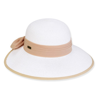 Three-quarter view of a white woven straw sun hat featuring a rounded crown and a tan ribbon band with a side bow.