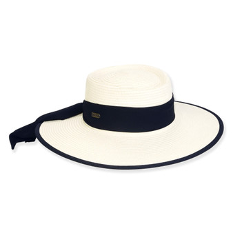 Three-quarter view of a white woven straw boater hat featuring a wide navy blue ribbon band and a matching navy-edged brim.
