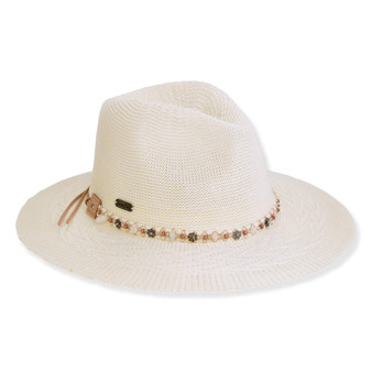 Three-quarter view of a white woven straw fedora featuring a beaded crown band, decorative side ties, and a wide brim.