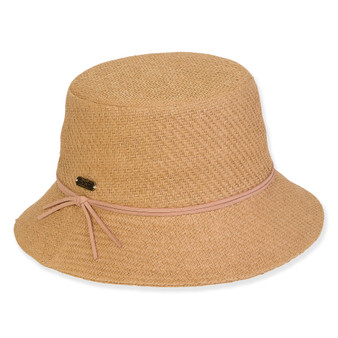 Three-quarter view of a tan woven bucket hat featuring a thin pink cord band with tie detailing and metallic hardware.