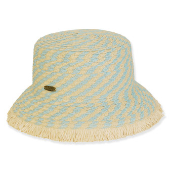 Three-quarter view of a woven straw bucket hat featuring a light blue and tan wave pattern with a fringed brim.