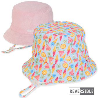 Three-quarter view of a reversible kids' bucket hat featuring a summer treat print side and a solid pink side.