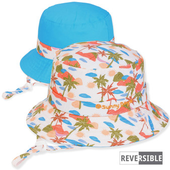 Three-quarter view of a reversible kids' bucket hat featuring a tropical palm tree print side and a solid turquoise side.