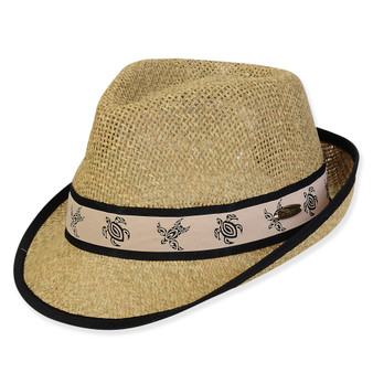 Three-quarter view of a natural straw fedora featuring a tan ribbon band with black turtle print and oval metal logo.