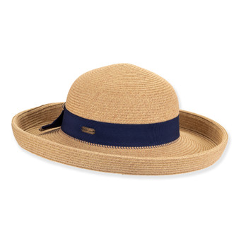 Front view woven beige upbrim hat with wide curved brim, rounded crown, textured straw weave, navy band, and small metallic emblem.