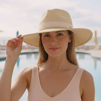 Lifestyle portrait of the Sun N Sand HH3500 Women’s Safari Hat in natural-toned woven straw, featuring a decorative braided-cord hatband and a structured crown for an adjustable fit and UPF 50+ sun protection.