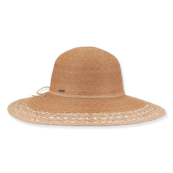 Three-quarter profile view of a black and tan woven straw floppy hat featuring a rounded crown, rope trim, and metal logo.