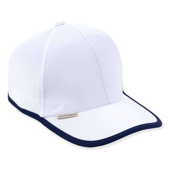Three-quarter view of a whiteperformance cap featuring smooth matte fabric, navy contrast piping, curved bill, and tan logo-plate.