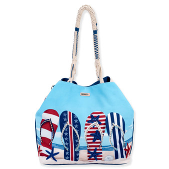 Front view of a rectangular blue crossbody bag featuring patriotic flip-flop graphics, red starfish, striped trim, and metal hardware.