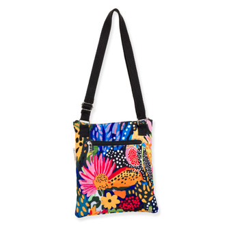 back view of a flat rectangular crossbody bag featuring a vibrant multi-colored floral and leopard print with three black zippers.